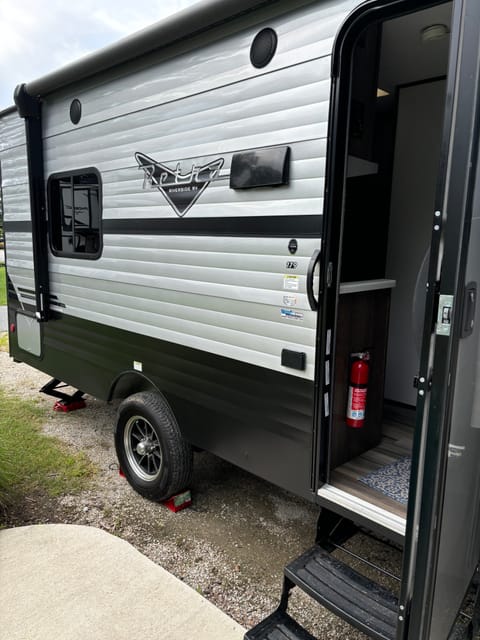 This is where you go into the RV and right next to the door is an outlet and above is a nice awning that I will need to add a photo so that you can see. 