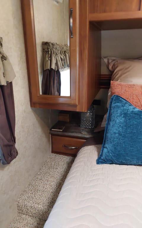 There are wardrobe closets on both sides of the bed and a larger coat closet by entry stocked with hangers.
Each side of bed has drawers as well plus an added feature a laundry chute on the right side of the bed.