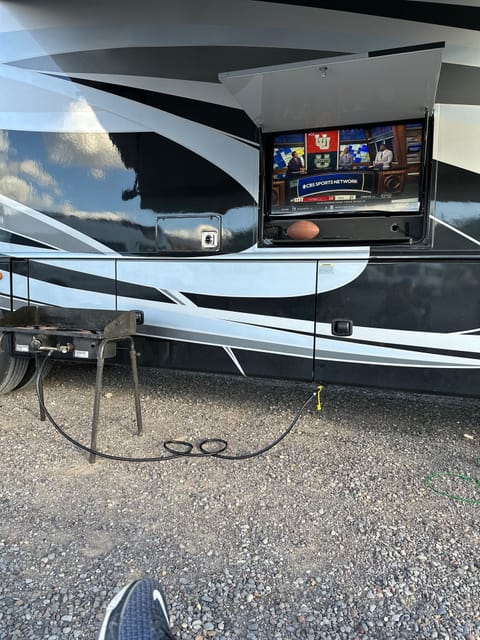 Outside tv and bbq hooks up quick connect right to the propane on the RV.