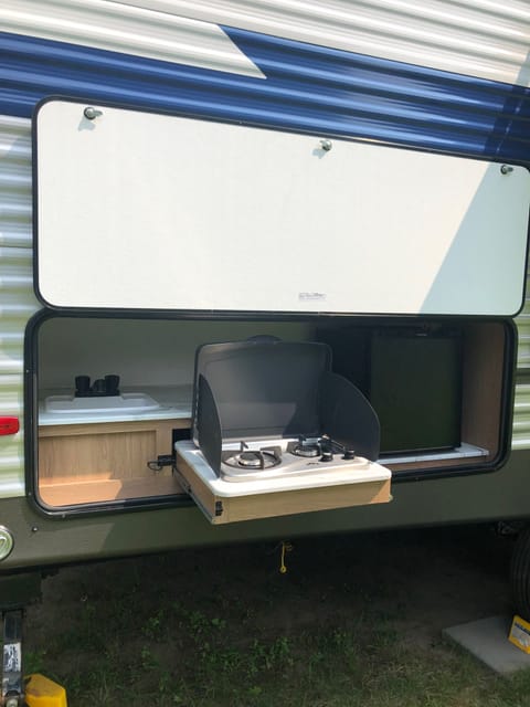 Outdoor kitchen comes with sink, 2 burner stove and mini fridge