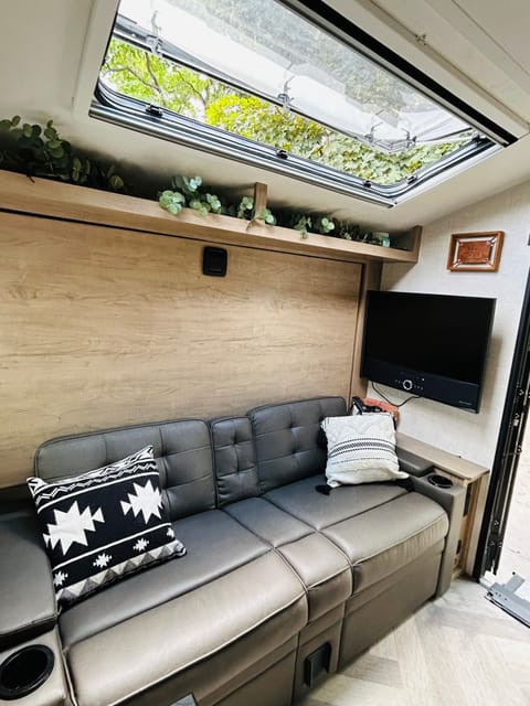 Couch and TV. The Queen Murphy bed pulls down. This set up gives you extra space in the camper during the day.