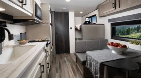 Huge sink, great fridge/freezer size, dinette converts to small bed. 