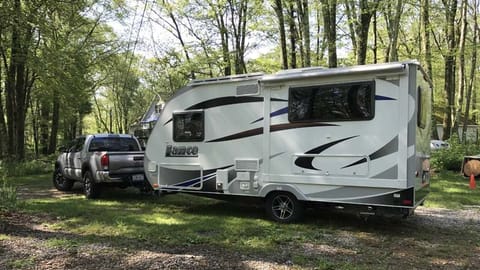 Small is the new big! We tow this trailer with a 2013 Toyota Tacoma without any issues. 