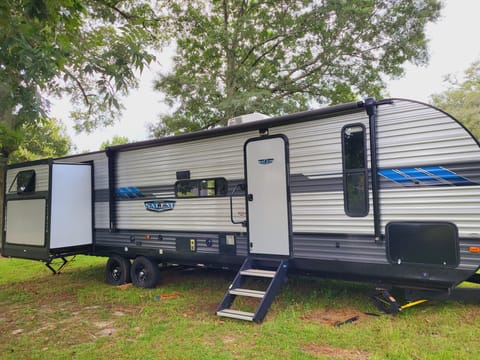 Motorized Awning With LED Lights. Bluetooth Soundbar Speaker, Outdoor Kitchen, Storage Compartment.