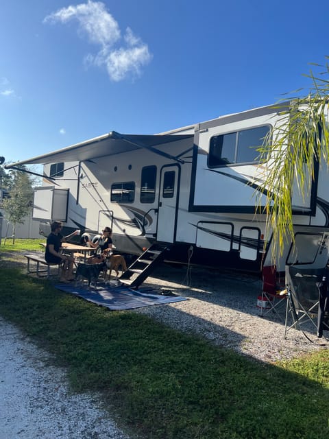 Awning provides wonderful shade. The outdoor mat and chairs are included in the rental.