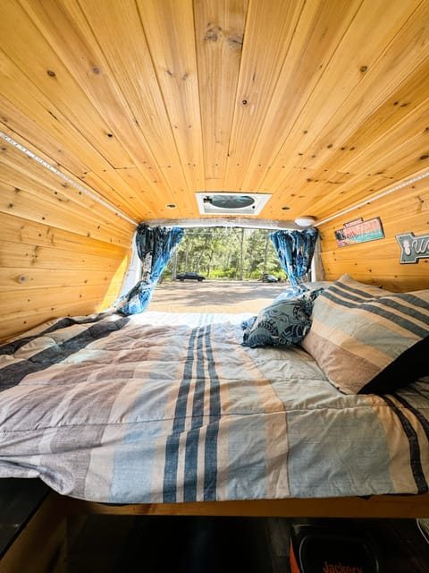 Your bedroom view opens up to where ever you want to be. Fresh bedding with hand-made cushions and special black-out curtains both at the back and front of the living area to allow you to sleep in. 