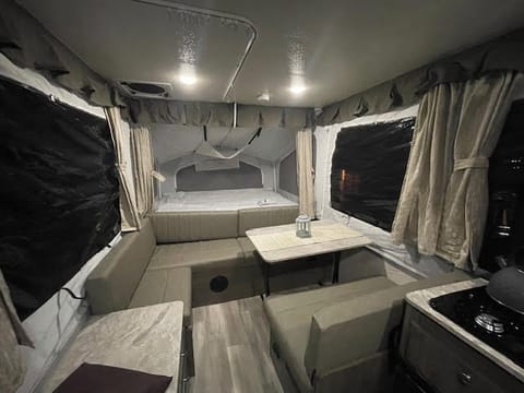 The lounging space is why we bought it. With the table folded up and put outside (in good weather) this area doubles as cocktail room and kids forts all the time. 