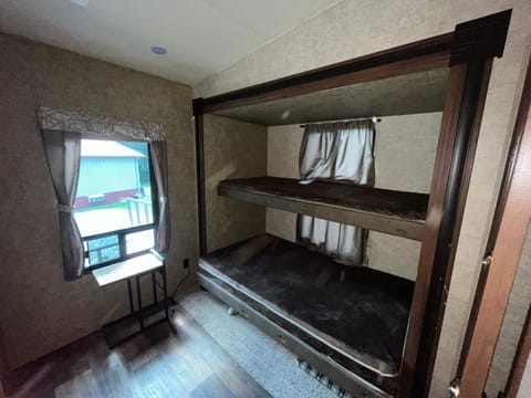 Two sleeping areas on opposite ends of the unit. This one has a bunk bed and half bath