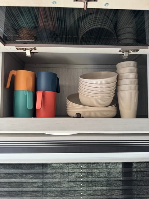 Mugs, plates, bowls, and cups are included. 