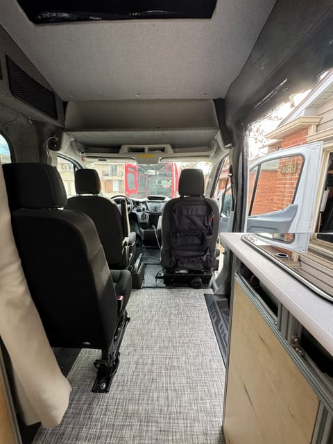This is main cabin, with diesel heater under passenger front seat. Also you can see plenty of shelves for storage above the passengers