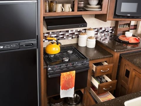 Fully Equipped Kitchen with Ample Storage and Countertop Space