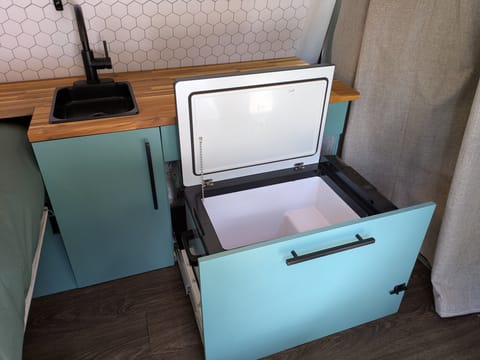 Faucet, Sink and Super efficient 12 volt Fridge means you won't have to worry about battery power. You can go completely off grid for days with the Solar Panels and Engine charging the Battery Bank too.