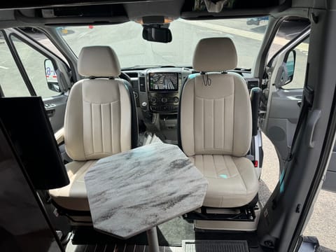 Seats turn 360 degrees providing desk work space, TV viewing in front and dining for 2