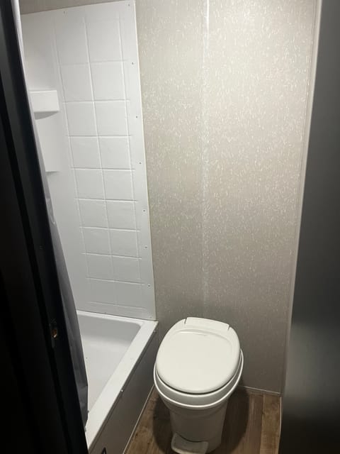 Toilet and shower. The shower also has a sink built in. 