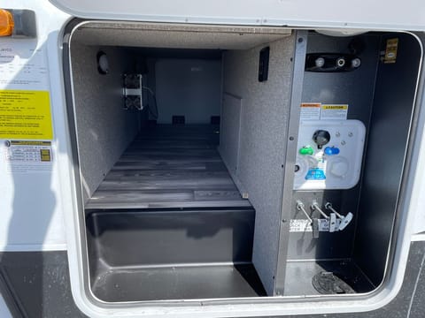 Underbelly storage and water control system. 