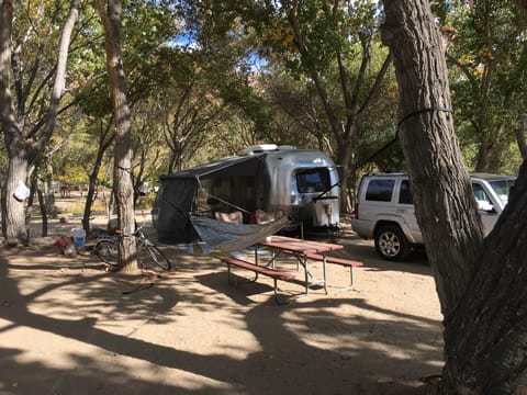 Camper set up with awning and screen room