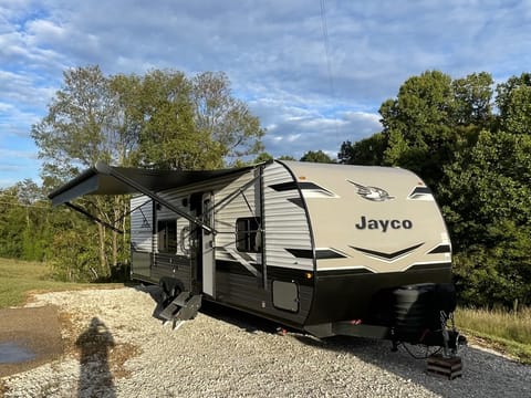 Exterior - with stairs and awning out.