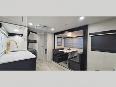 Stove, microwave oven, kitchen sink, fridge and freezer are standard in this spacious interior.