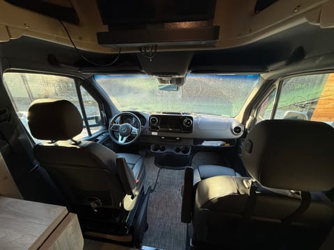 Dual captain chairs with powered seats and plenty of room to store accessories 