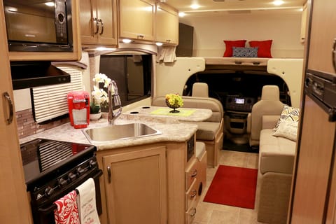 Interior showing the kitchen to dining lounge and bunk bed. 