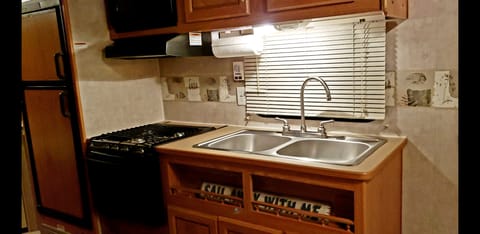 3 burners, oven, microwave and double sink 