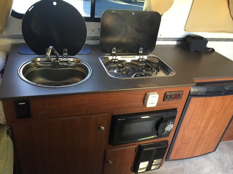 Sink, Stove, Mini Microwave and Fridge