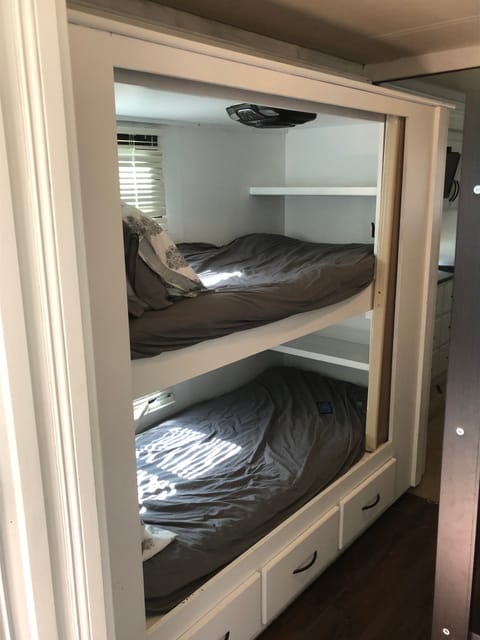 Bunks with DVD players and wireless headphones.  
