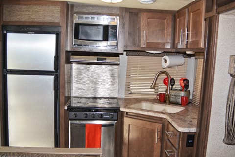 Beautiful easily accessible kitchen at the rear of the trailer!