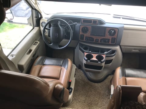 Very comfortable leather drivers seat with the Clarion Infotainment system. We connect my iPhone via bluetooth and listen to music or audiobooks throughout the RV.