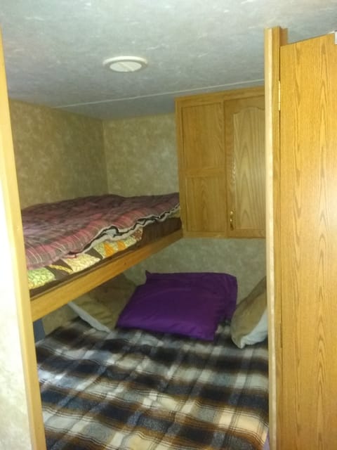 Main bed sleeps  2 adults, w/ bunk bed above. Sleeps one adult or two kids