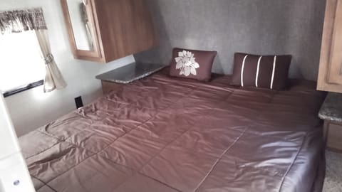 Bedroom in the front of the trailer; comes with a queen sized bed.  Also has storage on either side and above.
