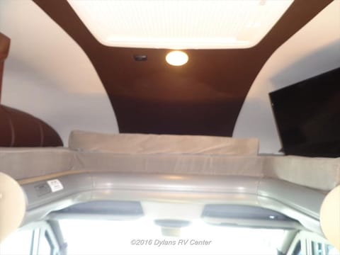 Over head bunk with separate light control and tv in bunk area viewable from main seating area or from bunk. 