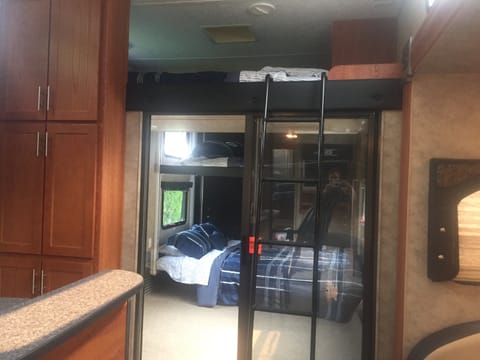 Sliding glass door to separate the garage area with a queen size bunk above