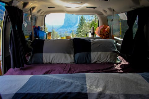 The bench inside the van folds out to become a bed at night. 