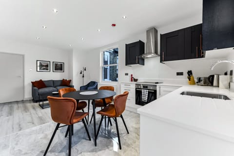 Burnt Orange & Bay Windows Apartment in London