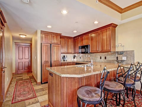 Breakfast bar seating looking into the kitchen.