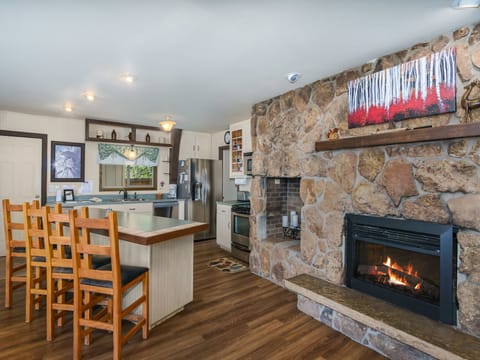 Sky View in the Rockies - Dining/kitchen with a breakfast bar, 4 chairs and a fireplace
