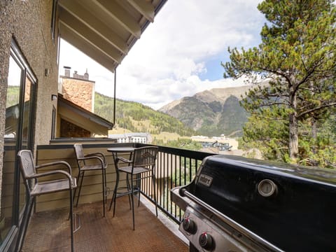 Private balcony offers seating a grill, along with great mountain views.