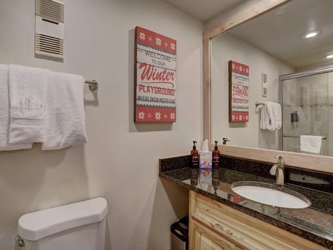 Main level bathroom, off of kitchen.