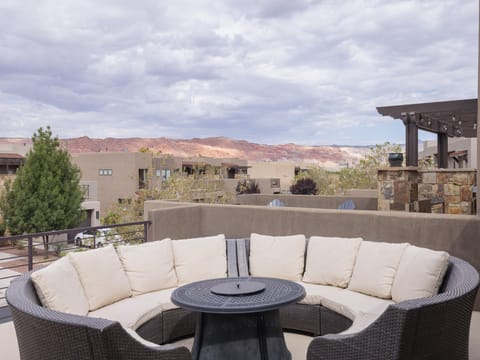 Stay warm next to the firepit and relax while watching the sunset over the red mountains.