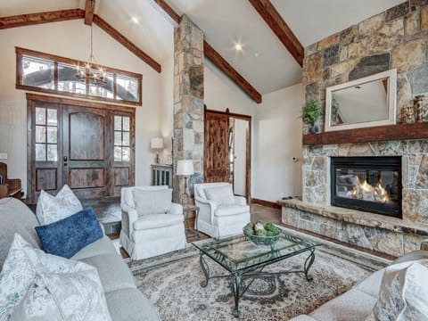 Cozy up by the fireplace in this spacious main living area - Breck Escape Breckenridge Vacation Rental