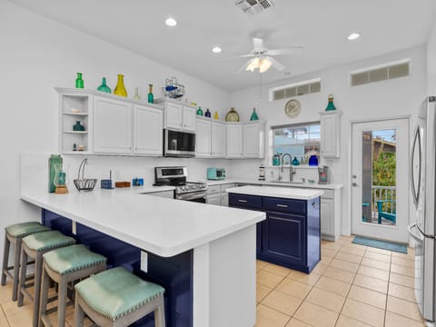 Spacious kitchen with center island and bar seating for 4.