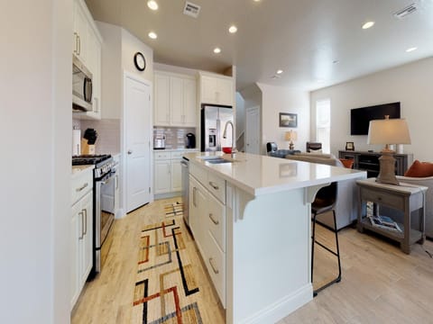 Fully stocked gourmet kitchen featuring stainless steel appliances