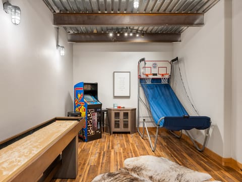 Enjoy Game room with BBall, Shuffleboard and packman and fooseball