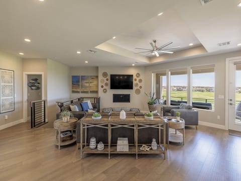 Enjoy the ambiance of the gas fireplace and/or watching the large flat screen tv. The great room is even spacious enough for a dance party!