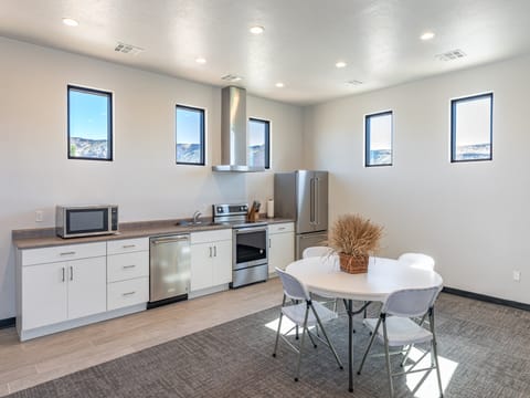 This beautiful kitchen area is conveniently located next to pool and other amenities. Reservations are required to use this area and can be made through the HOA manager.