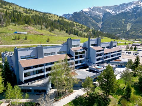 Beautiful aerial shot of Snowbridge with a mountain backdrop.