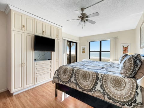 Master bedroom  with beach view and balcony access