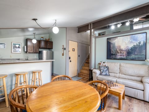 Living/Dining area opens to bedroom loft up the stairs.