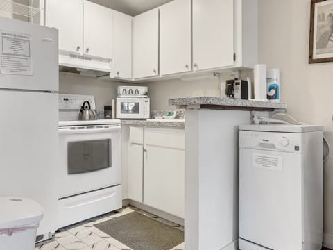 Updated kitchen with portable dishwasher for your convenience.